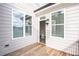 Private deck with access from interior; features wood planks and exterior lighting at 5215 Riden Ct, Buford, GA 30518