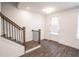 Spacious entryway with staircase, wood-look floors, and an exterior door at 5215 Riden Ct, Buford, GA 30518