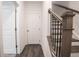 Bright hallway with wooden flooring and doors to rooms at 5215 Riden Ct, Buford, GA 30518