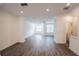 Open concept living room with hardwood floors and neutral walls at 5215 Riden Ct, Buford, GA 30518