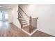 Modern staircase featuring wood and metal accents at 5215 Riden Ct, Buford, GA 30518