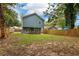 Fenced backyard with view of house and trees at 1302 Ladd St, Atlanta, GA 30310