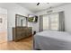 Bright bedroom featuring a dresser, large TV, and ample closet space at 1302 Ladd St, Atlanta, GA 30310