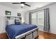 Charming bedroom with a queen bed, TV, and plenty of natural light at 1302 Ladd St, Atlanta, GA 30310