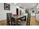 Dining room with dark wood table and view into kitchen at 1302 Ladd St, Atlanta, GA 30310