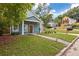 Cute blue house with a walkway leading to the front door and well manicured lawn at 1302 Ladd St, Atlanta, GA 30310