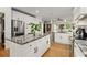 Modern kitchen featuring a large island with granite countertops and stainless steel appliances at 1302 Ladd St, Atlanta, GA 30310