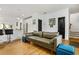 Spacious living room with hardwood floors, open concept floorplan, and view of kitchen at 1302 Ladd St, Atlanta, GA 30310