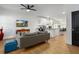 Open concept living room with kitchen view and hardwood floors at 1302 Ladd St, Atlanta, GA 30310