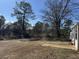 Backyard with patio and trees at 3295 Highway 138 Ne, Conyers, GA 30013