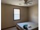 Simple bedroom with window and ceiling fan at 3295 Highway 138 Ne, Conyers, GA 30013