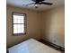 Empty bedroom with window and ceiling fan at 3295 Highway 138 Ne, Conyers, GA 30013