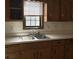 Classic kitchen with wood cabinets and double sink at 3295 Highway 138 Ne, Conyers, GA 30013