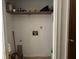 Laundry closet with shelving and hook for cleaning supplies at 3295 Highway 138 Ne, Conyers, GA 30013