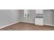 Small bedroom with wood flooring and neutral walls at 5337 Tolar Rd, South Fulton, GA 30213