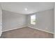 Bright bedroom with neutral walls and carpet flooring at 5337 Tolar Rd, South Fulton, GA 30213