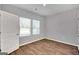 Simple bedroom with wood flooring and neutral walls at 5337 Tolar Rd, South Fulton, GA 30213