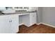 Kitchen with white cabinets and brown flooring at 5337 Tolar Rd, South Fulton, GA 30213