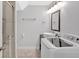 Bathroom with shower, washer and dryer, and modern vanity at 6851 Roswell Rd # J1, Atlanta, GA 30328