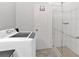 Bathroom with shower, washer and dryer, and modern vanity at 6851 Roswell Rd # J1, Atlanta, GA 30328