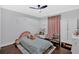 Bright bedroom featuring hardwood floors, a comfortable bed, ample space, and a playful ambiance at 6851 Roswell Rd # J1, Atlanta, GA 30328