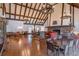 Expansive clubhouse lounge featuring a stone fireplace and rustic wooden beams on the ceiling at 6851 Roswell Rd # J1, Atlanta, GA 30328