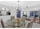Open dining area with pass-through to the kitchen and seamless transition to the living room at 6851 Roswell Rd # J1, Atlanta, GA 30328