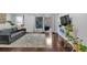 Relaxing living room with sliding glass doors to the patio and a modern entertainment center at 6851 Roswell Rd # J1, Atlanta, GA 30328