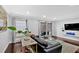 Inviting living room featuring a modern entertainment center and sliding doors to the outdoor patio at 6851 Roswell Rd # J1, Atlanta, GA 30328