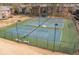 Aerial view of the community tennis courts with benches and lush landscaping at 6851 Roswell Rd # J1, Atlanta, GA 30328