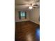 Spacious bedroom with dark hardwood floors and ceiling fan at 794 Old Allatoona Se Rd, Cartersville, GA 30121