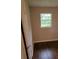 Small bedroom with dark hardwood floors and window at 794 Old Allatoona Se Rd, Cartersville, GA 30121