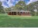 Brick ranch house with a large yard and covered deck at 794 Old Allatoona Se Rd, Cartersville, GA 30121