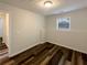 Basement bedroom with new flooring and neutral walls at 85 Kristen Pl, Covington, GA 30016