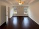 Spacious bedroom with dark hardwood floors and multiple windows at 85 Kristen Pl, Covington, GA 30016