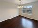 Bright dining room with hardwood floors and a large window at 85 Kristen Pl, Covington, GA 30016