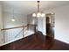 Open dining area with hardwood floors and views to kitchen and living room at 85 Kristen Pl, Covington, GA 30016