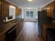 Kitchen with dark brown cabinets and laminate flooring at 85 Kristen Pl, Covington, GA 30016