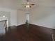 Spacious living room with hardwood floors and a ceiling fan at 85 Kristen Pl, Covington, GA 30016