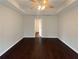 Main bedroom with dark hardwood floors and an ensuite bathroom at 85 Kristen Pl, Covington, GA 30016