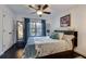 Charming bedroom with a comfortable bed, large window, and ceiling fan at 2305 Sherbrooke Ne Dr, Atlanta, GA 30345