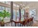 Elegant dining room featuring a large table, chandelier, and access to backyard at 2305 Sherbrooke Ne Dr, Atlanta, GA 30345