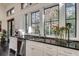 Sunlit kitchen features stainless steel appliances and white cabinetry at 2305 Sherbrooke Ne Dr, Atlanta, GA 30345