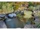 Peaceful pond with cascading waterfall and stone border at 2305 Sherbrooke Ne Dr, Atlanta, GA 30345