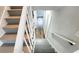 Stairs leading to the upper level with gray carpeting and white railings at 2653 Williamsburg Dr, Decatur, GA 30034