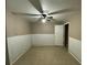 Unfinished bedroom with ceiling fan and tile floors at 5174 Stone Trce, Stone Mountain, GA 30083