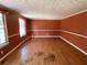 Living room with hardwood floors and orange walls at 5174 Stone Trce, Stone Mountain, GA 30083