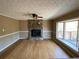 Living room with stone fireplace and hardwood floors at 5174 Stone Trce, Stone Mountain, GA 30083