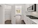 Modern kitchen with white cabinets, subway tile backsplash, and a gas cooktop at 13541 Whitman Ln, Covington, GA 30014