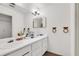 Double vanity bathroom with two sinks and large mirror at 1214 Overton Dr, Lawrenceville, GA 30044